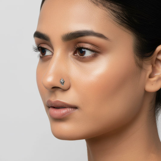 Silver Ganpati Nose pin on a white background by silver world