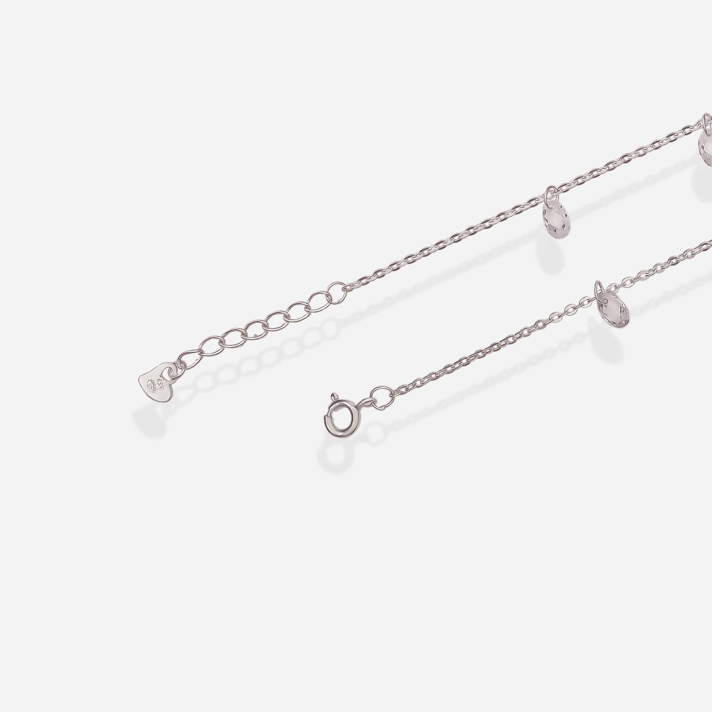 Silver chain bracelet on a white background