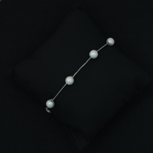 Pearl barrette on a black background