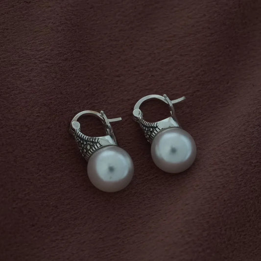 Pearl earrings with marcasite drops by Silver World.