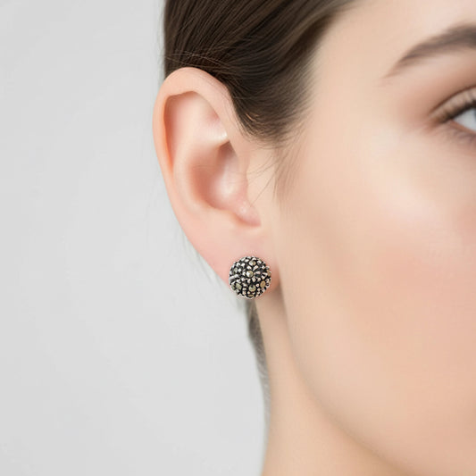 Close-up of a woman's ear wearing a decorative earring by Silver World - Best Silver shops in Delhi.