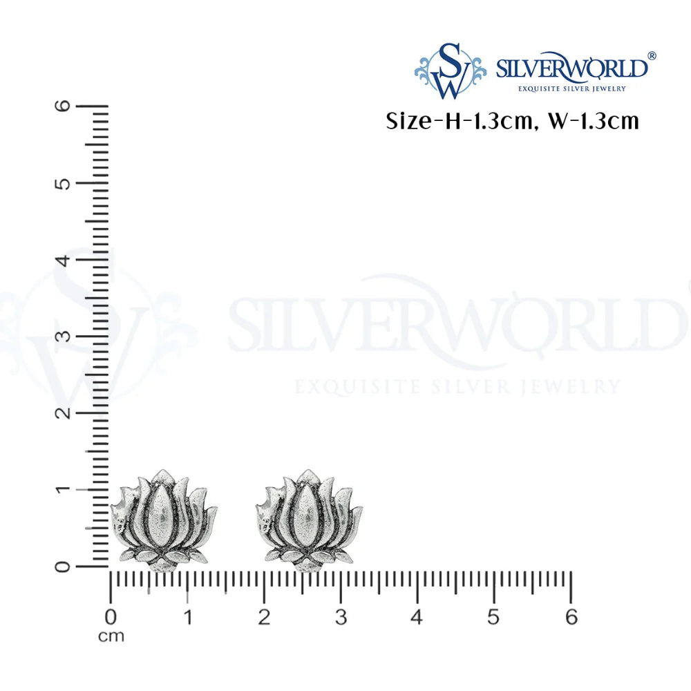 Silver earrings with a ruler for scale on a white background, featuring the SilverWorld brand.