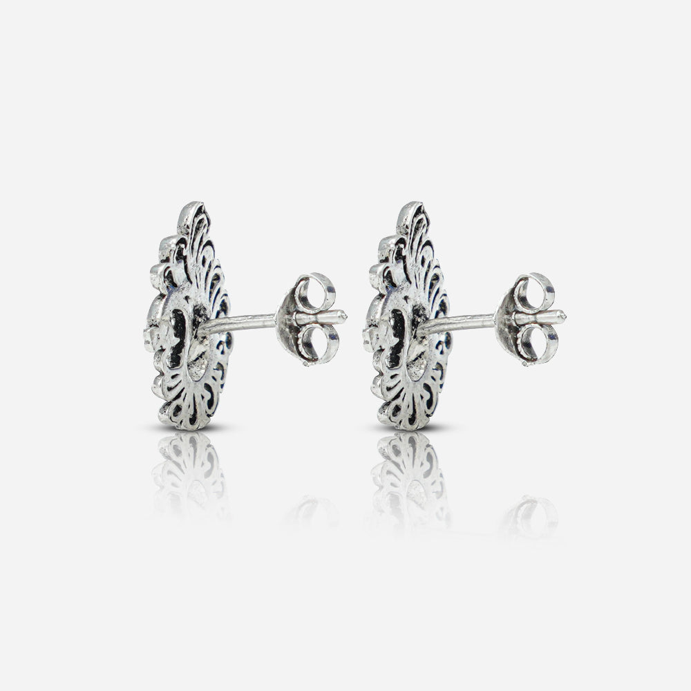 Pair of silver earrings with intricate designs