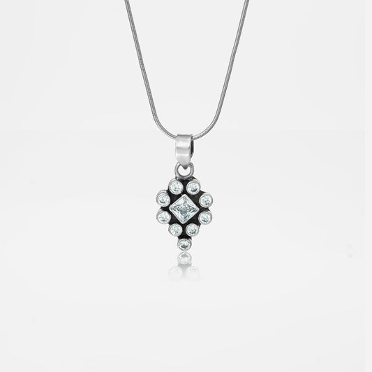 Silver necklace with a diamond pendant on a white background
