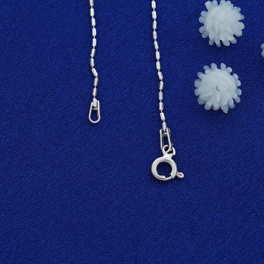 Silver necklace chain with clasp on a blue background