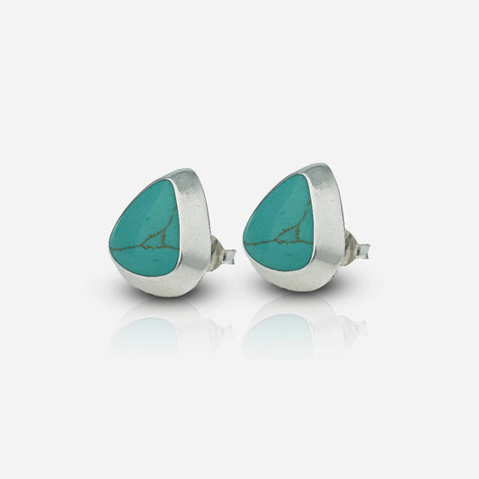 Teardrop-shaped turquoise stones in silver settings