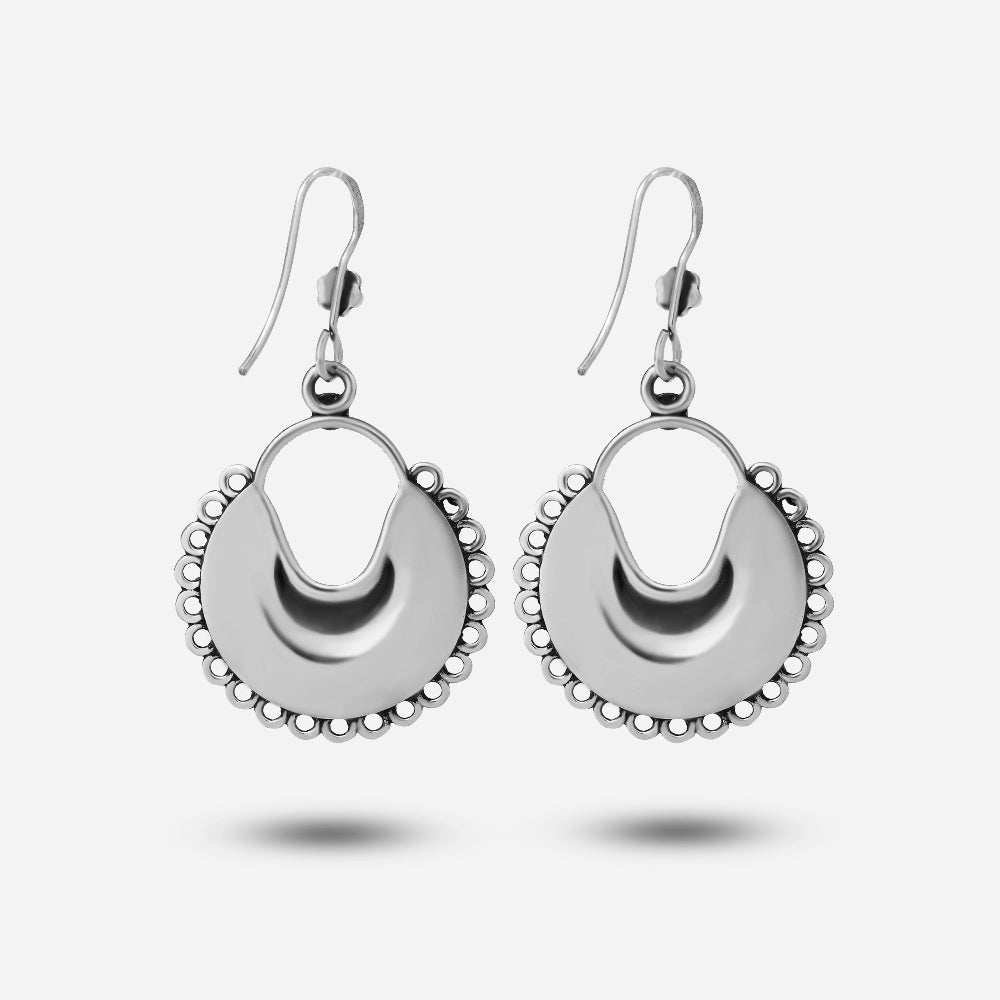 Pair of silver moon earrings on a white background