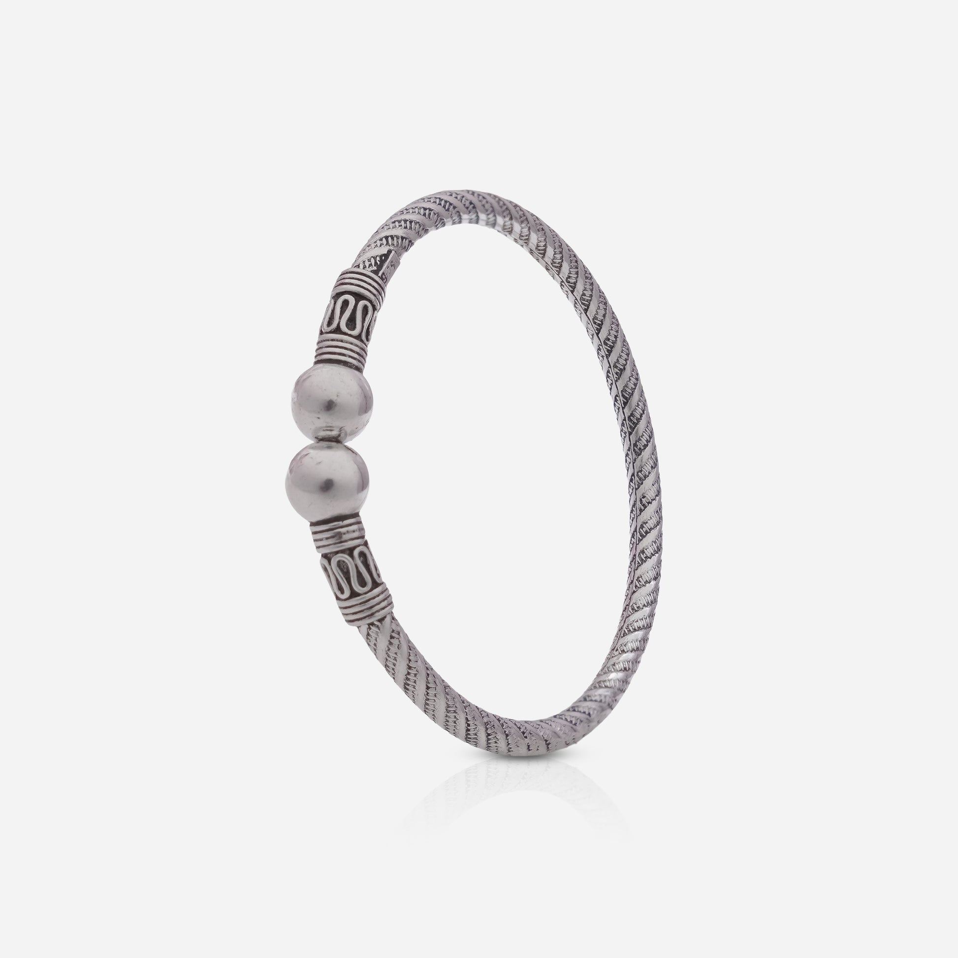 Silver bracelet with beads on a white background