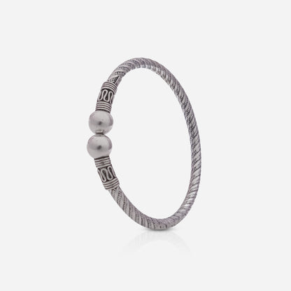 Silver bracelet with beads on a white background
