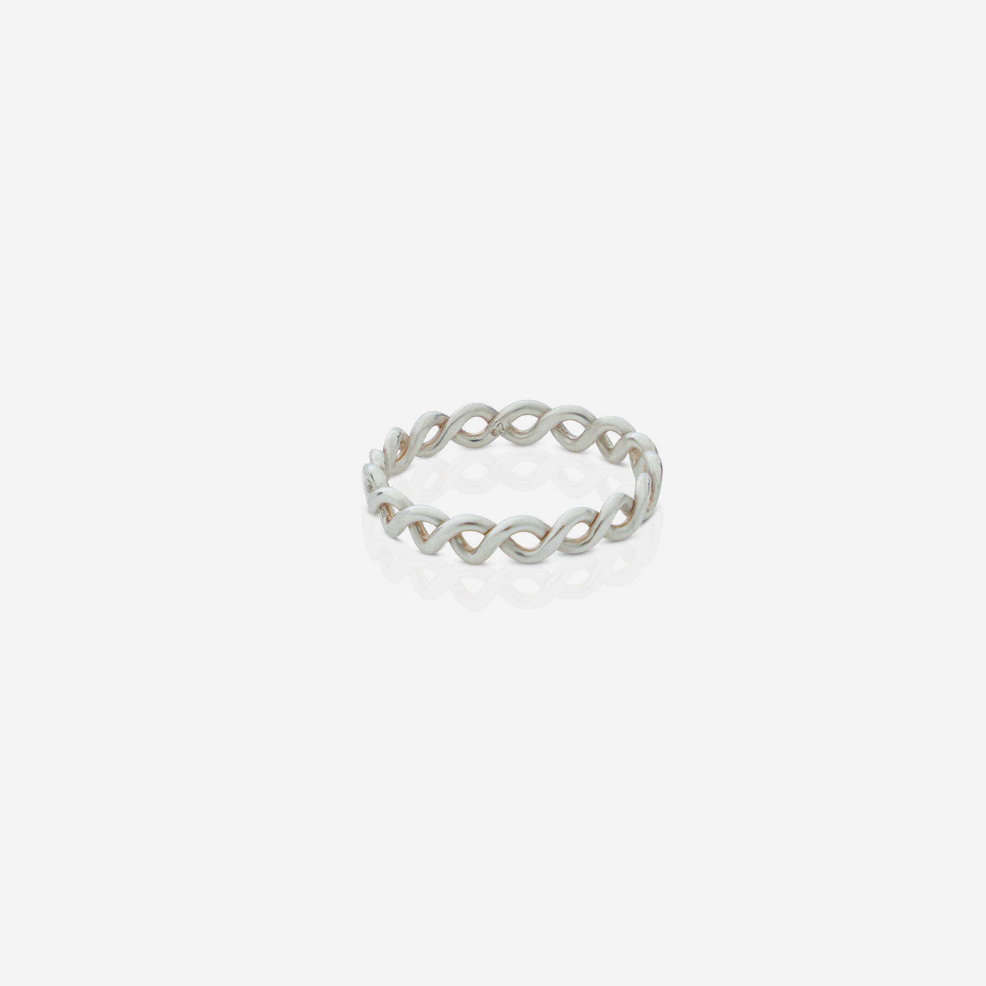 Silver ring with a chain design on a white background