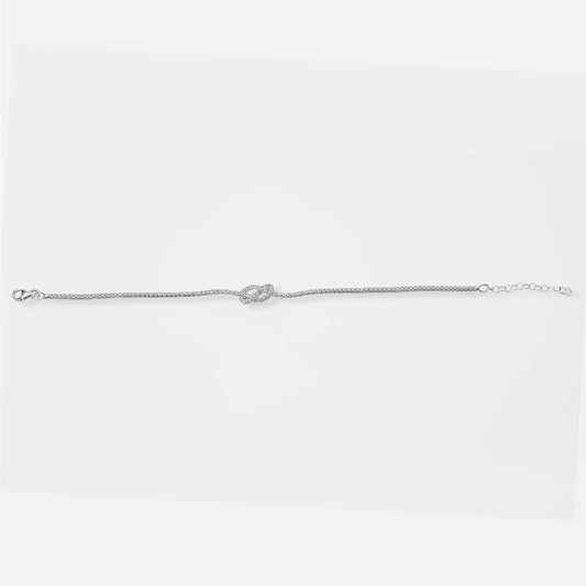 Silver knot bracelet on a light gray background