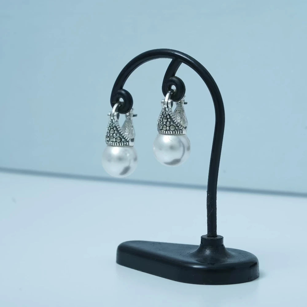 Pearl earrings with marcasite drops by Silver World.