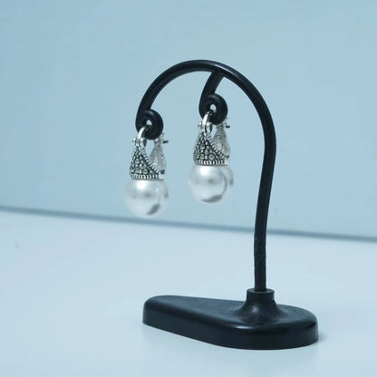 Pearl earrings with marcasite drops by Silver World.