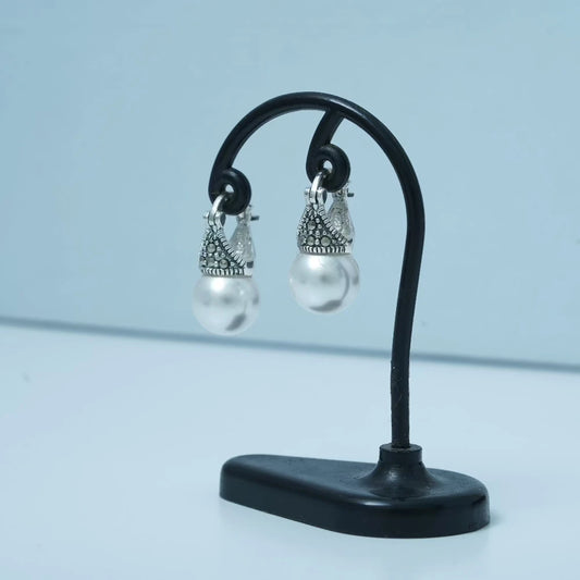 Pearl earrings with marcasite drops by Silver World.