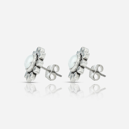 Silver earrings with gemstones on a white background