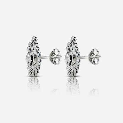 Pair of silver earrings with intricate designs 