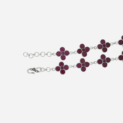 Silver bracelet with purple flower-shaped links