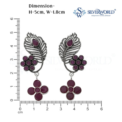 Pair of silver earrings with purple stones and feather design
