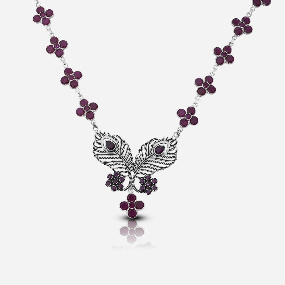 Necklace with peacock feather design and purple gemstones