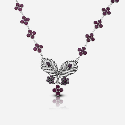Necklace with peacock feather design and purple gemstones