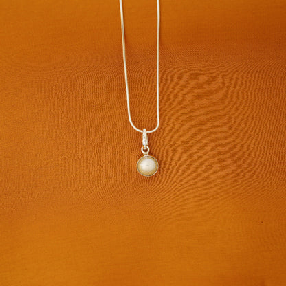 a silver necklace with a pearl pendant by Silver World.
