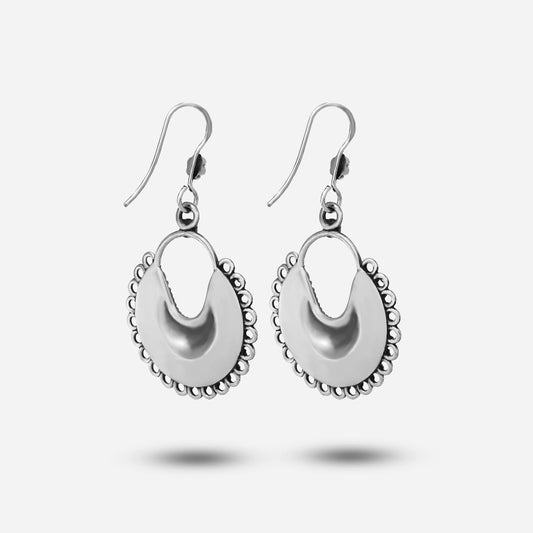 Pair of silver moon earrings on a white background