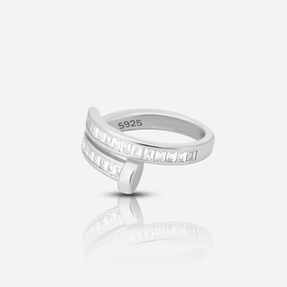 Silver spiral ring with baguette cut stones on a white background
