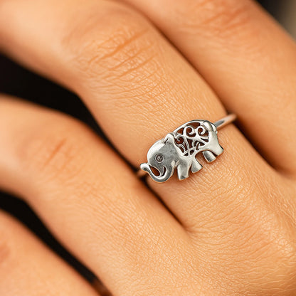 Silver elephant ring with heart design on a finger