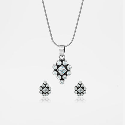 Silver jewelry set with pendant and earrings.