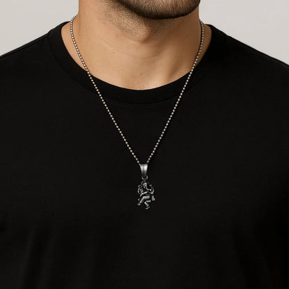 Ganesh Silver necklace with a pendant on a person wearing a black shirt