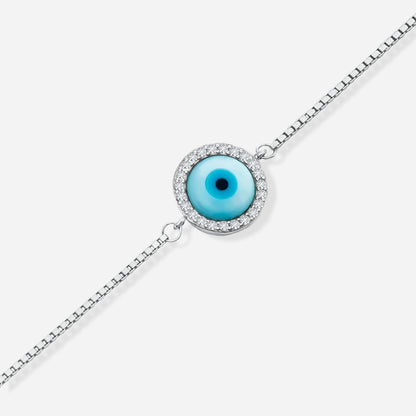 Bracelet with a blue evil eye pendant on a white background