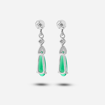 Pair of silver earrings with green teardrop-shaped stones on a white background