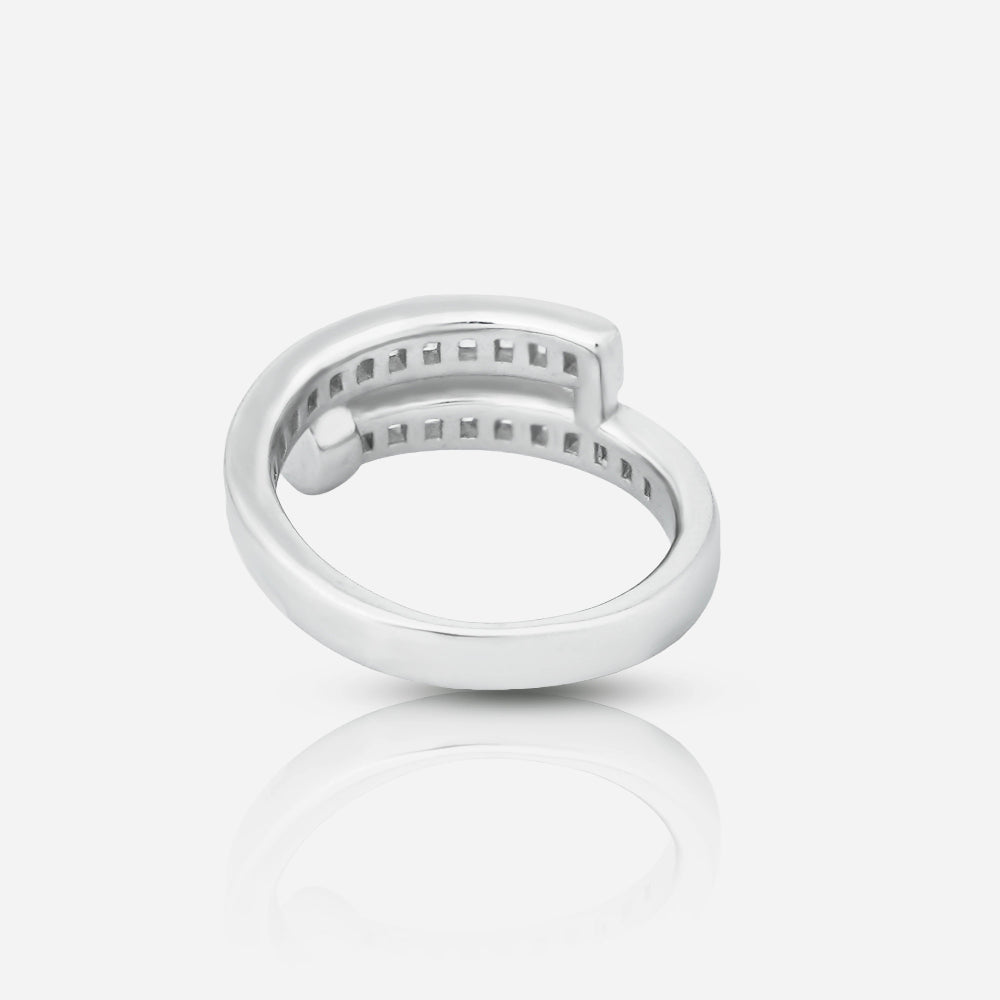 Silver ring with small stones on a light gray background