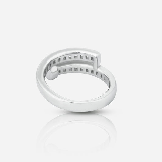 Silver ring with small stones on a light gray background