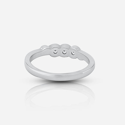 Silver ring with engraved design on a white background