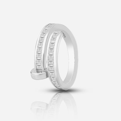 Silver ring with diamond accents on a white background