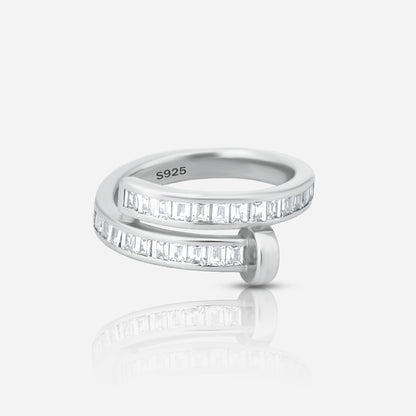 Silver ring with diamond accents on a white background