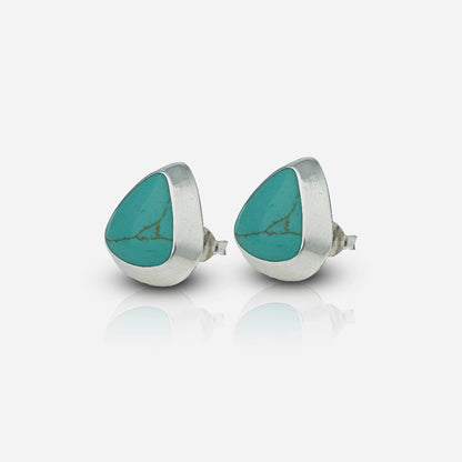 Teardrop-shaped turquoise stones in silver settings 
