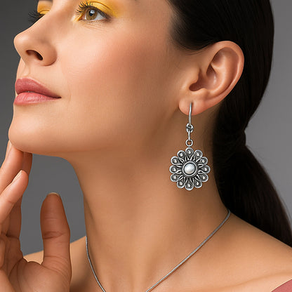 flower design earrings on model