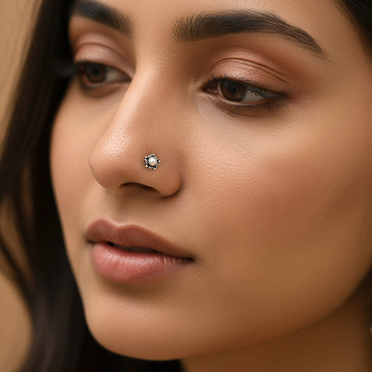 Close-up of a woman's face with a nose ring by silver world - best silver shops in Delhi