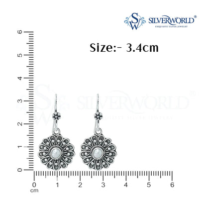 silver flower design earrings scale